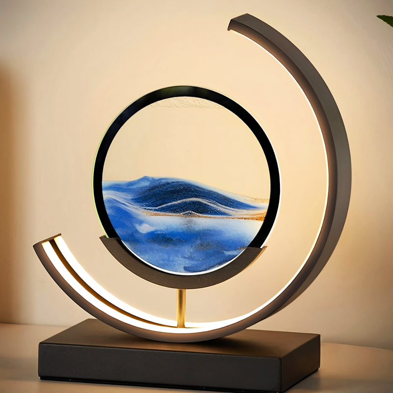 Decorative lamp with circular design and water scene inside, on a neutral background